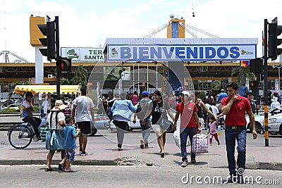 People cross road near bus - train station, Santa Cruz Editorial Stock Photo