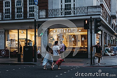 People crossing the road in front of Pret A Manger in London, UK. Editorial Stock Photo