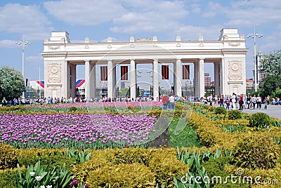 People crowds enter and leave Gorky park by the main entrance gates. Editorial Stock Photo