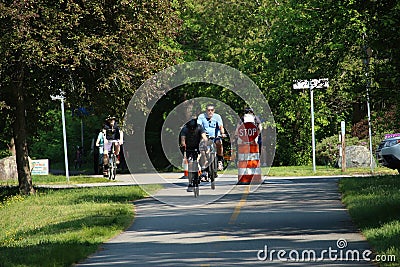 People cycling, Jogging and walking on the bikeway in the afternoon , Lexington, MA. USA. May 21, 2023 Editorial Stock Photo