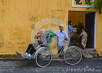 People with the cyclo on street in Hoi An, Vietnam Editorial Stock Photo