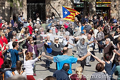 People dancing circle dance long sardana at Catedral square Editorial Stock Photo