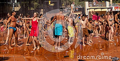 People dancing in water fountain Editorial Stock Photo