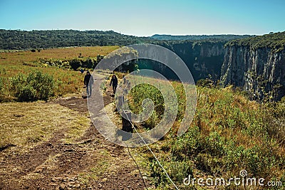People on dirt pathway at the Itaimbezinho Canyon Editorial Stock Photo