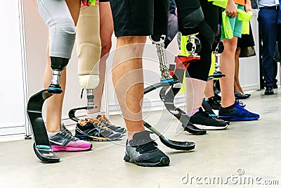 People with disabilities play sports. Running leg prosthesis for an active lifestyle. Many athletes with amputated legs. Cropped Stock Photo