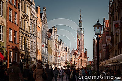 People on Dlugi Targ street in Gdansk. View of the Town Hall Tower Editorial Stock Photo