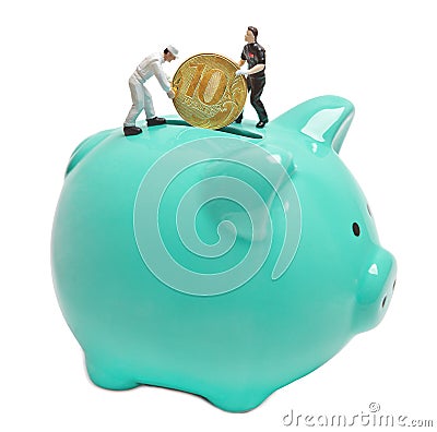 People-dolls put a ten-ruble coin in the piggy Bank. Stock Photo