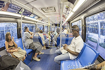 people in the downtown Metro bus in Miami, USA. Metrobus operates more than 90 routes with close to 1,000 buses covering 41 Editorial Stock Photo