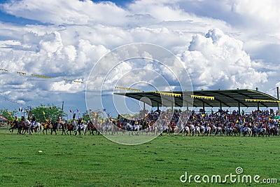 People dressed up as horses in parks, at festivities, on the street, enjoying fairs and parties with people watching them, holdin Stock Photo