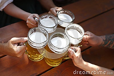 People drinking beer in a traditional Bavarian beer garden Stock Photo