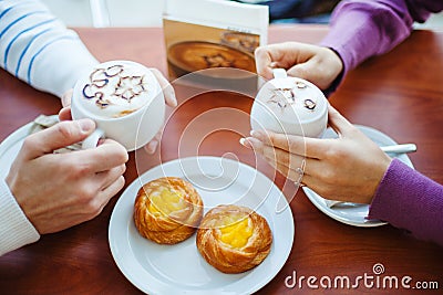 People Drinking Coffee. Closeup Hands with Cups. Stock Photo