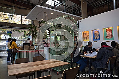 People drinking coffee and working at San Pedro Square Market in San Jose Editorial Stock Photo