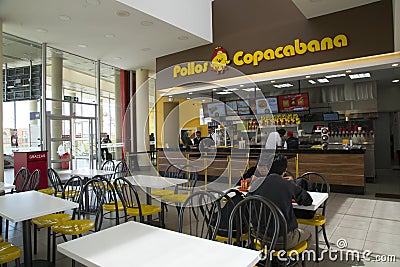 People eat in fast food restaurant Pollos Copacabana Editorial Stock Photo