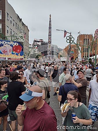Eating At A Street Fair, Our Lady Of Mount Carmel, Feast Of The Giglio, Brooklyn, NY, USA Editorial Stock Photo