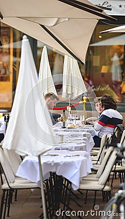 People eating outside at Maison Kammerzell iconic restaurant as bars and Editorial Stock Photo