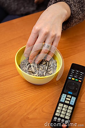 People eating roasted sunflower seed Stock Photo