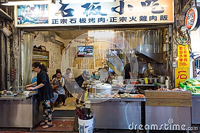 People eating at a small restaurant in Wulai Editorial Stock Photo