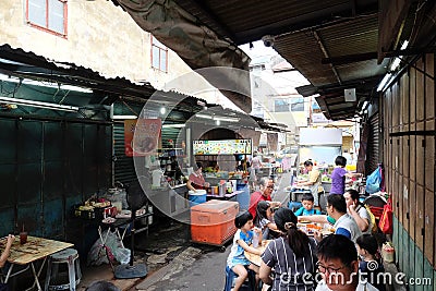 People eating street food on the alley in the famous chulia food Editorial Stock Photo
