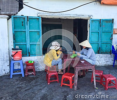 People eating street foods in Vung Tau, Vietnam Editorial Stock Photo