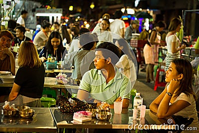 People eating on thestreets of the Koa San road area of Bangkok, Editorial Stock Photo