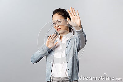 People, emotions and lifestyle concept. Portrait of displeased and disgusted asian woman defending herself from someone Stock Photo