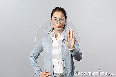 People, emotions and lifestyle concept. Tell you to stop. Serious-looking young strict asian female tutor, teacher or Stock Photo
