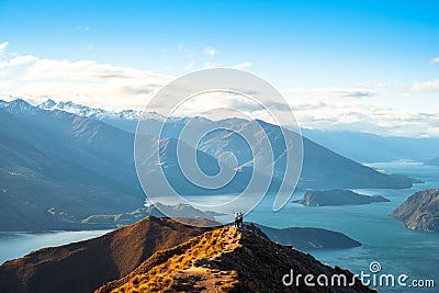 People enjoy with a beautiful landscape of the mountains and Lake Wanaka. Roys Peak Track, South Island, New Zealand. I Stock Photo