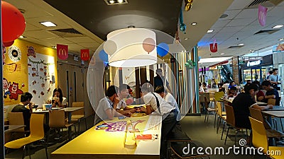 People enjoy delicious food at McDonald`s restaurant in shenzhen, China Editorial Stock Photo