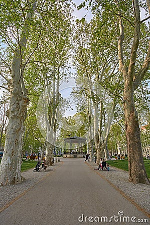 Zagreb, Croatia, April 24, 2019: People enjoying in afternoon walking in Green promenade with a view of old vintage pavilion in th Editorial Stock Photo