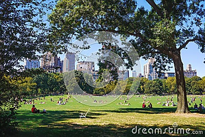 People enjoying a beautiful sunny day in Central Park Editorial Stock Photo