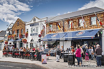 People enjoying nice weather in Dublin Howth and dining outdoors, Ireland Editorial Stock Photo