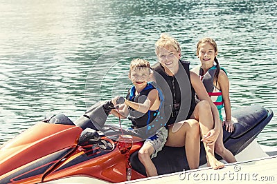 People enjoying a ride on a personal watercraft Stock Photo