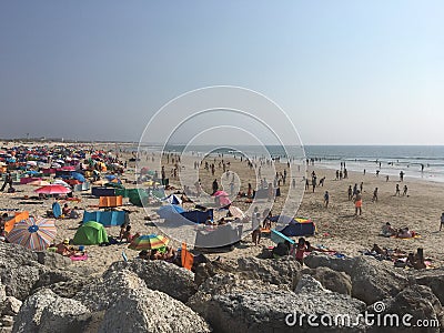 People enjoying the sun at The beach Editorial Stock Photo