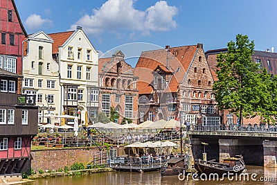 People enjoying the sun in the historic harbor of Luneburg Editorial Stock Photo