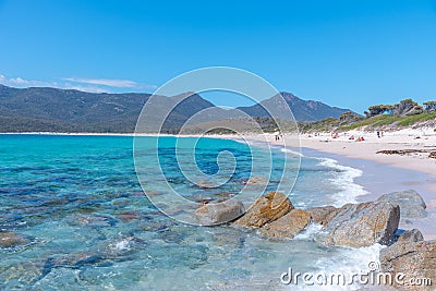 People are enjoying a sunny day at Wineglass bay in Tasmania, Australia Editorial Stock Photo