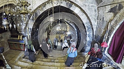 People enter in the temple Maria grotto in Jerusalem Editorial Stock Photo