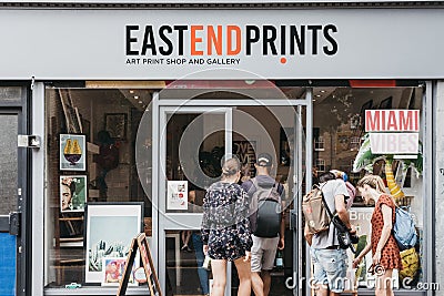 People entering East End Prints shop in East London, UK. Editorial Stock Photo