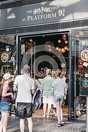 People entering Harry Potter shop by 9 3/4 platform inside King` Editorial Stock Photo