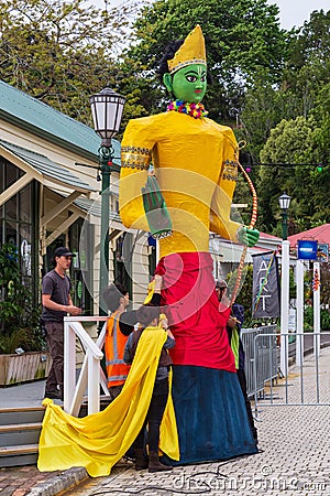 People erecting a large statue of the Hindu god Rama, New Zealand Editorial Stock Photo