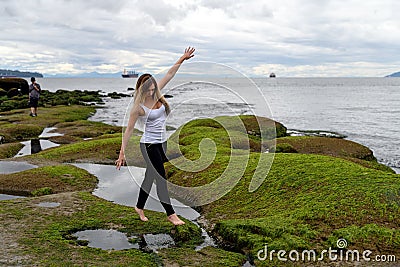 People exploring the intertidal zone of Vancouver, British Colum Stock Photo