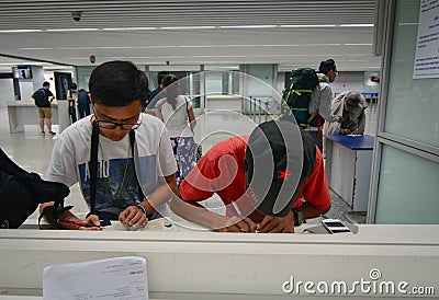 People fill the form paper at airport in Kolkata, India Editorial Stock Photo