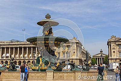 People by Fountain of River Commerce and Navigation on the Place de la Concorde at sunny day. Editorial Stock Photo