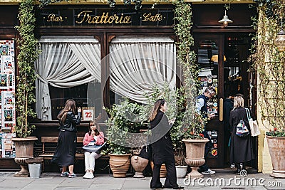 People by the front entrance of Gloria, Italian restaurant in Shoreditch, London, UK Editorial Stock Photo