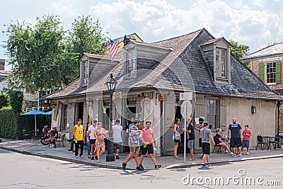 People gathered at Jean Lafitte`s Blacksmith Shop in the French Quarter Editorial Stock Photo