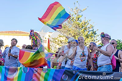 People gathering with rainbow flags in gay pride day in Torremolin Editorial Stock Photo