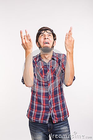People, gesture and fashion concept - excited angry handsome man isolated over white Stock Photo
