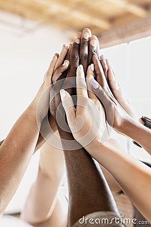 People giving each other a high five Stock Photo