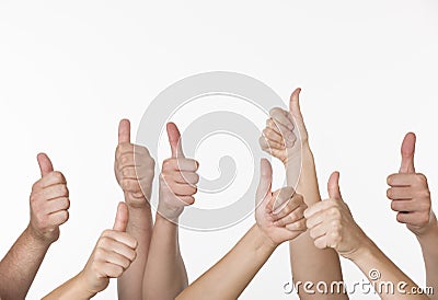 People Giving Thumbs-up Stock Photo