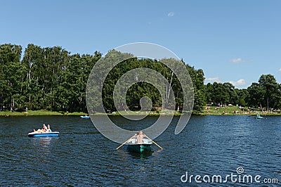 People go boating in the natural-historical park `Kuzminki-Lublino`. Editorial Stock Photo