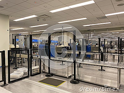 People going through Orlando International Airport MCO TSA security on a busy day Editorial Stock Photo